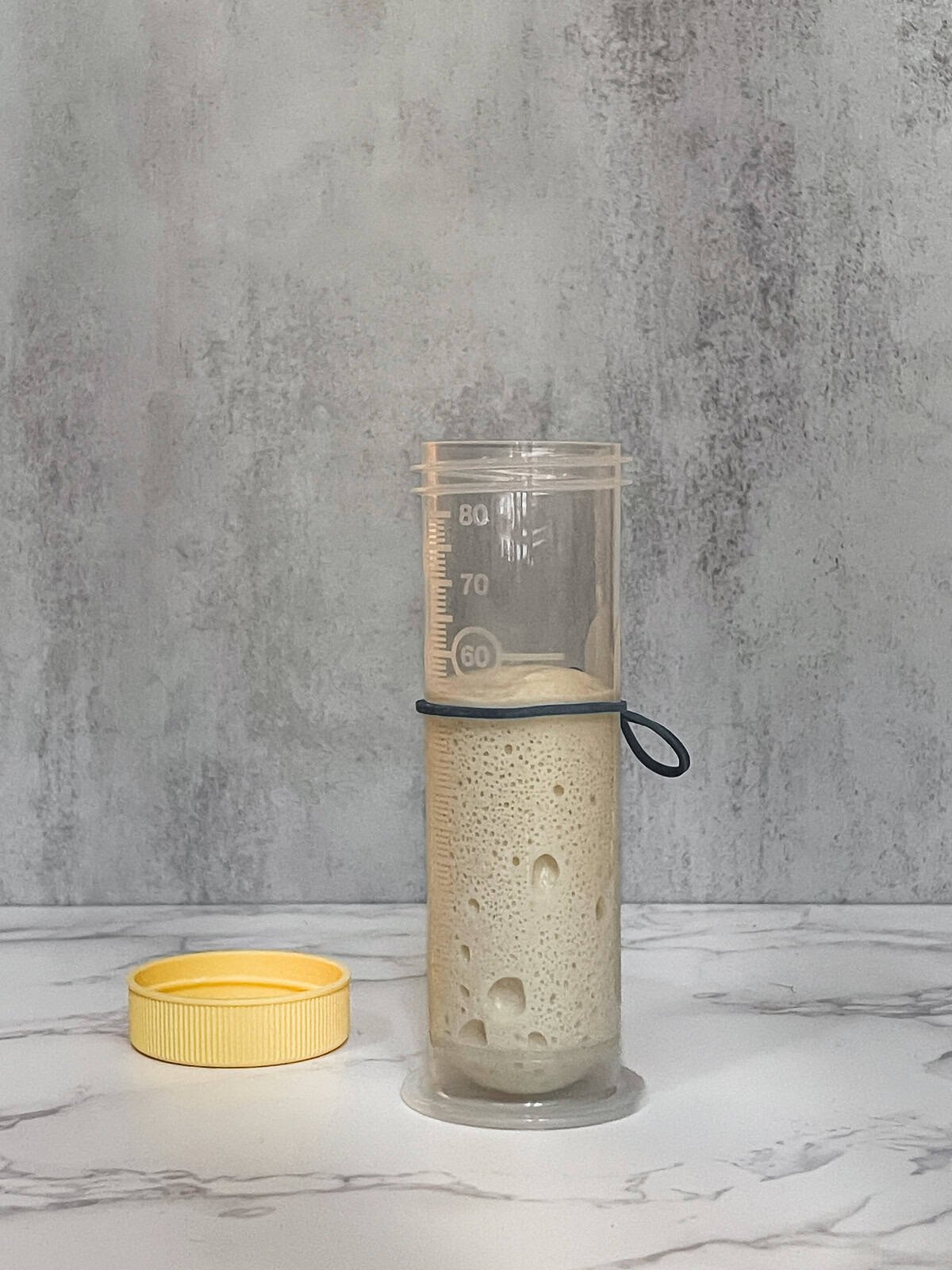 Aliquot Jar: dough sample in a straight-sided jar beside the bulk dough