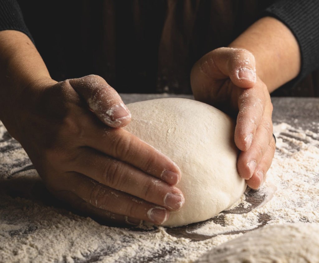 Shaping: hands shaping a boule